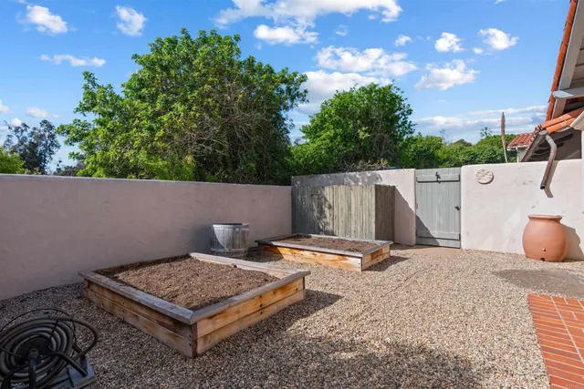 an aerial view of a house with a garden