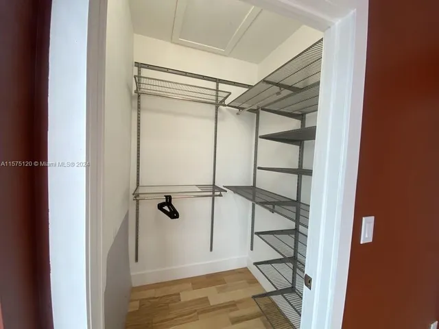 a view of an empty walk in closet