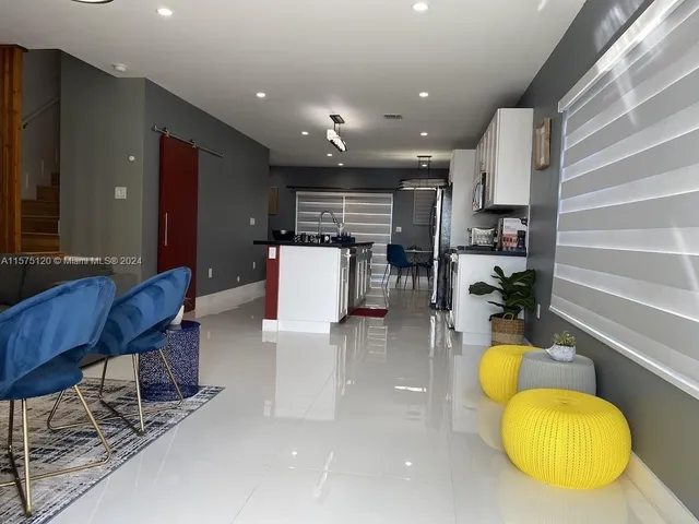 a view of a hallway with washer and dryer