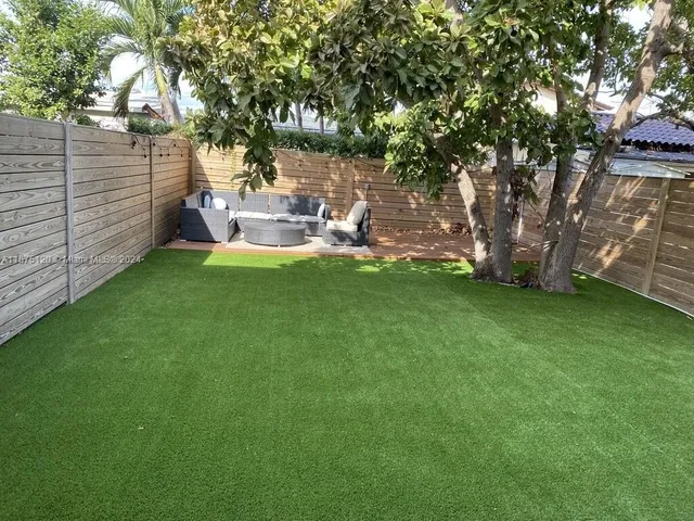 a view of a garden with a bench