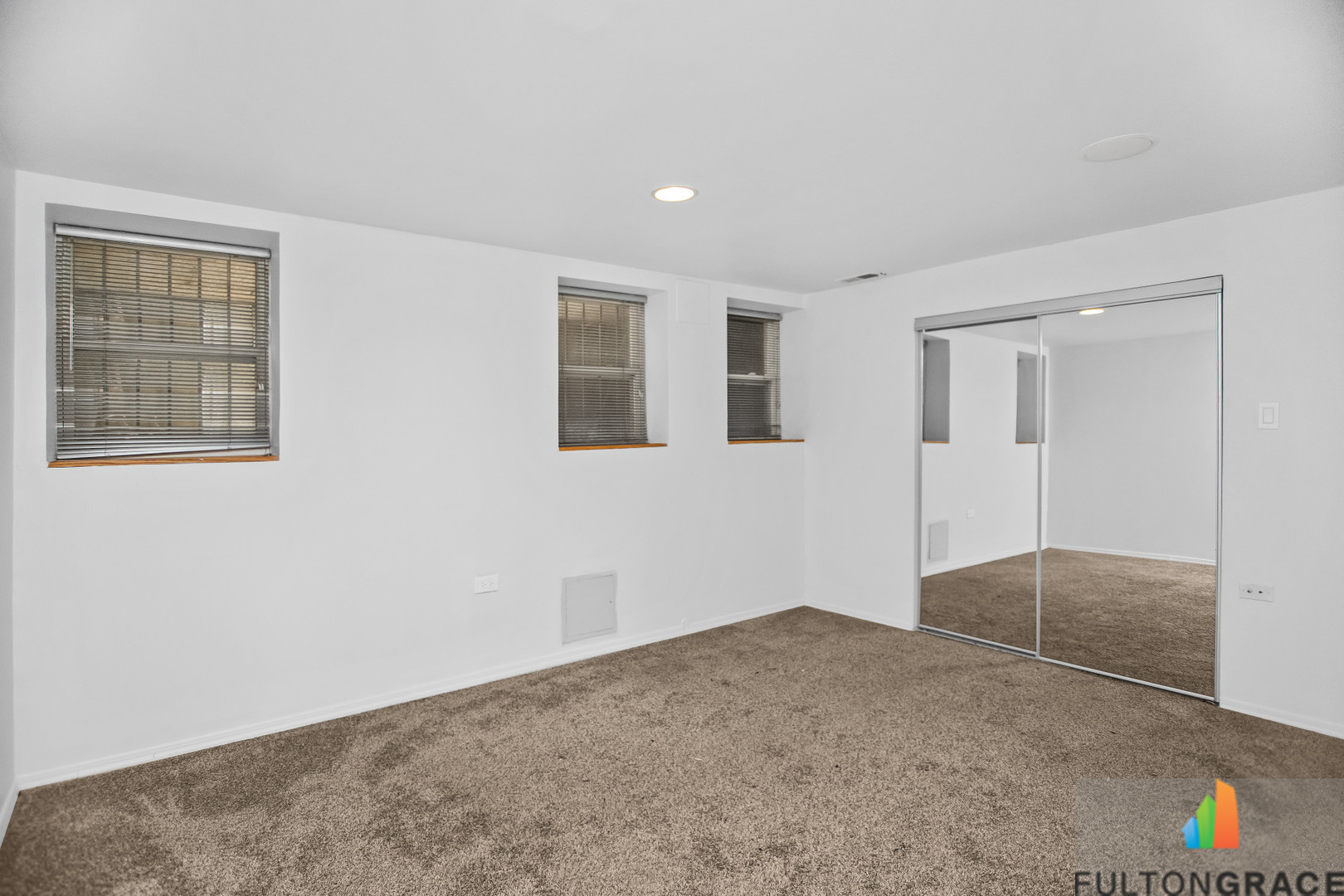 2744 West Warren Boulevard, Unit 1 Chicago, IL 60612 - Photo 8 of 15 an empty room with windows