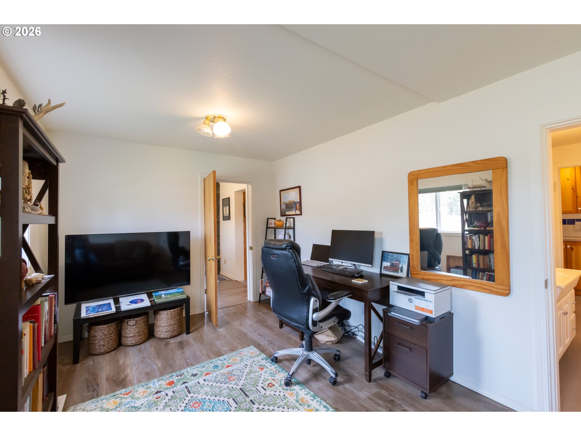 56 Jennings Road Trout Lake, WA 98650 - Photo 11 of 42 a living room with furniture and a flat screen tv