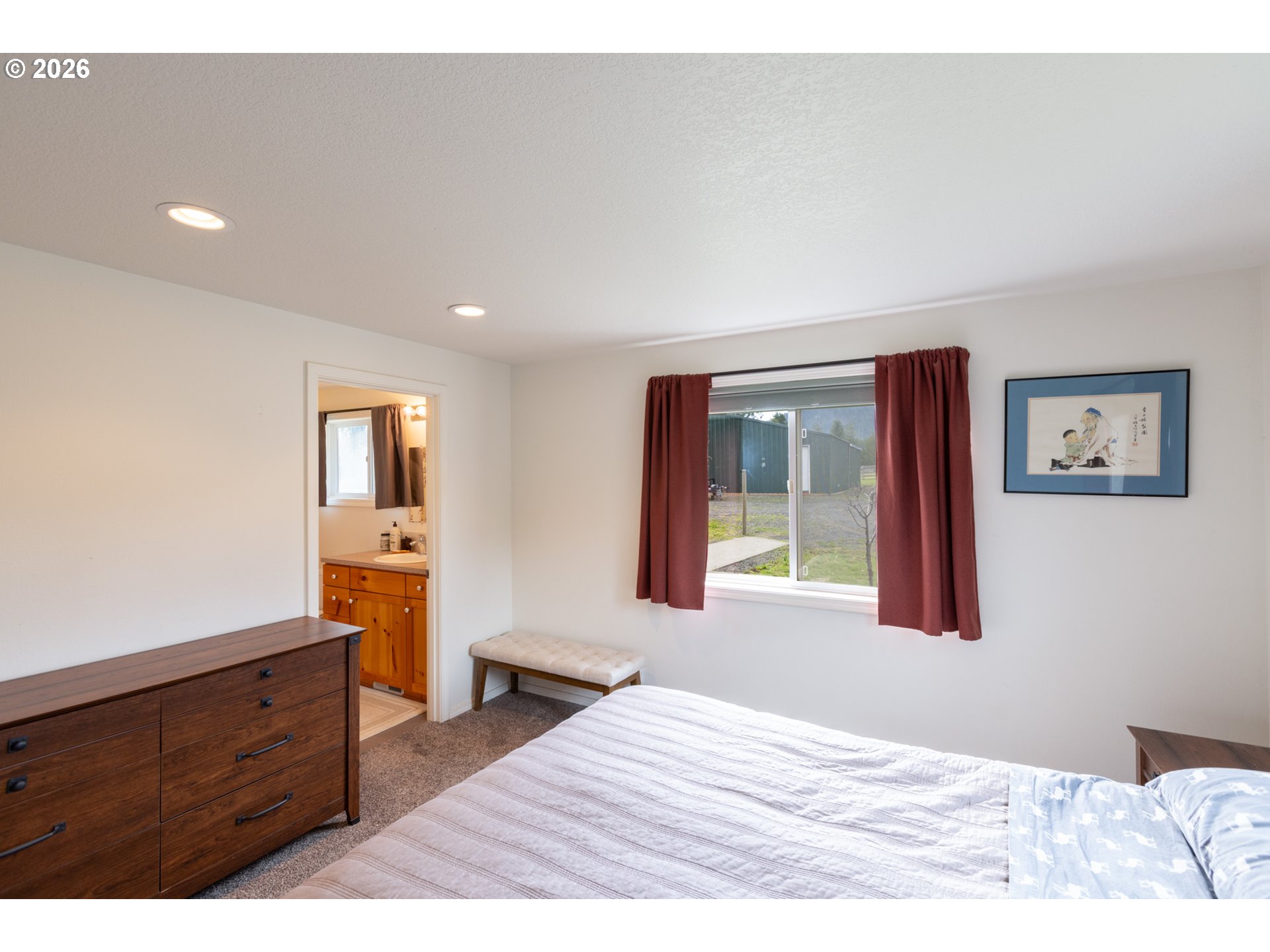 56 Jennings Road Trout Lake, WA 98650 - Photo 15 of 42 a bedroom with a bed and a dresser