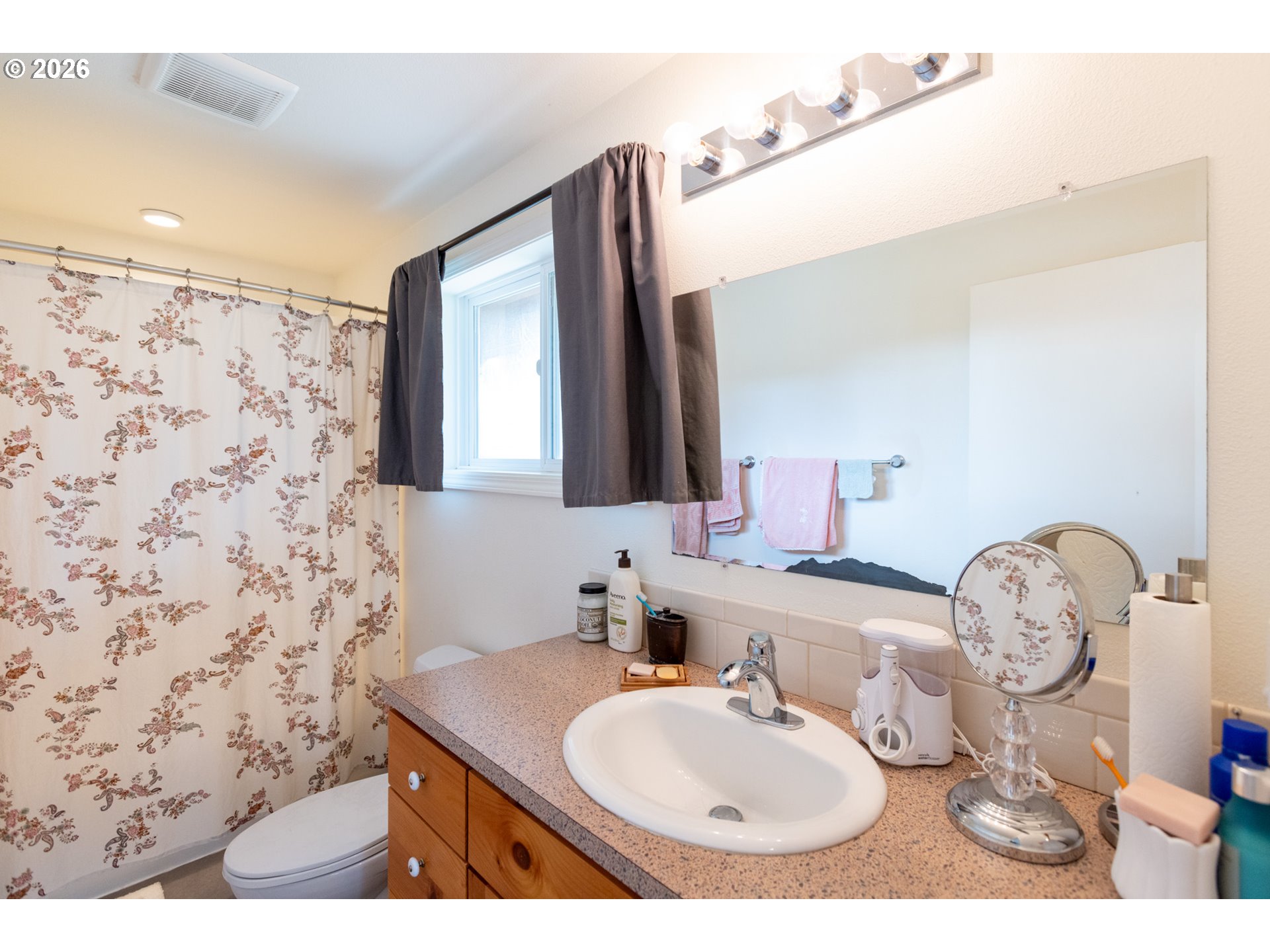 56 Jennings Road Trout Lake, WA 98650 - Photo 16 of 42 a bathroom with a sink vanity mirror and toilet
