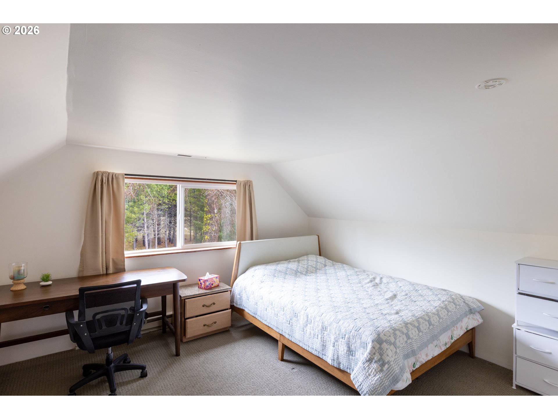 56 Jennings Road Trout Lake, WA 98650 - Photo 20 of 42 a bedroom with a bed and a table