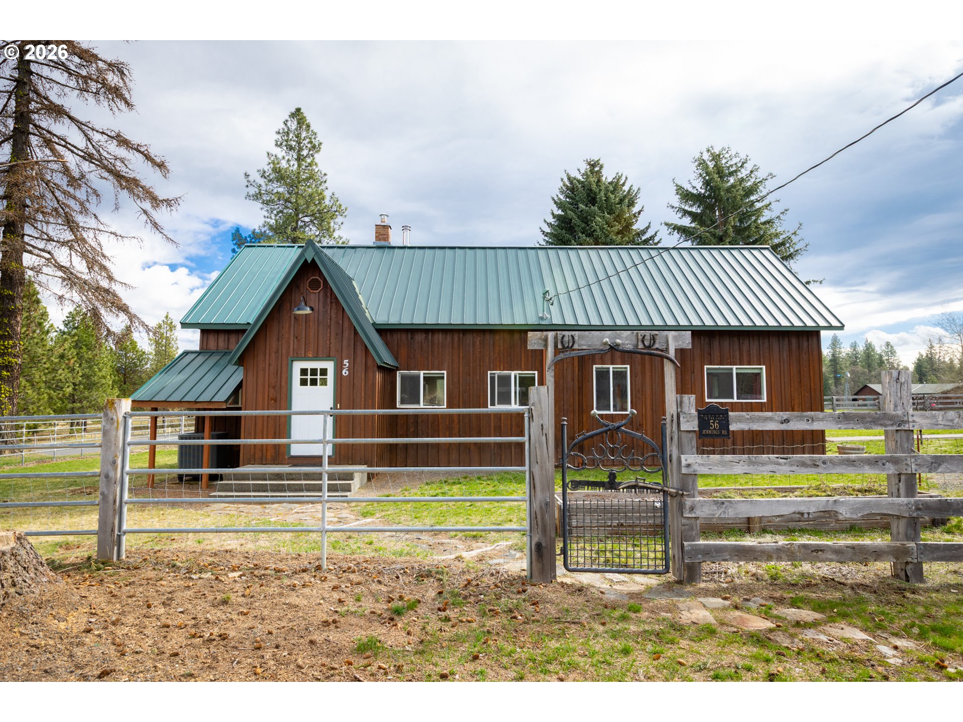 56 Jennings Road Trout Lake, WA 98650 - Photo 2 of 42 a front view of a house with a yard