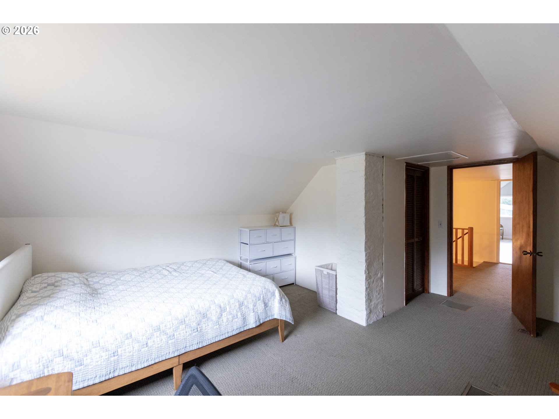 56 Jennings Road Trout Lake, WA 98650 - Photo 21 of 42 a bedroom with a bed and a lamp