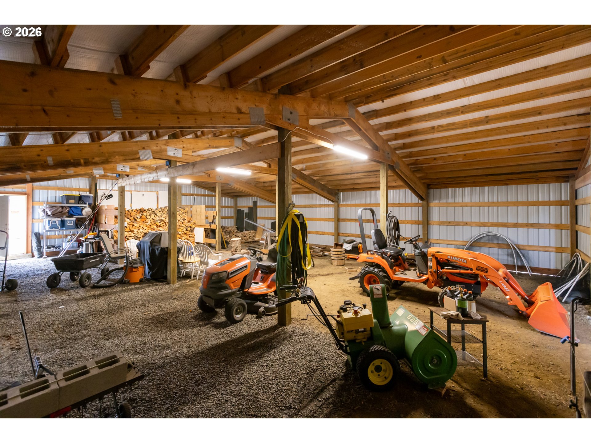 56 Jennings Road Trout Lake, WA 98650 - Photo 34 of 42 a view of a garage with a table and chairs
