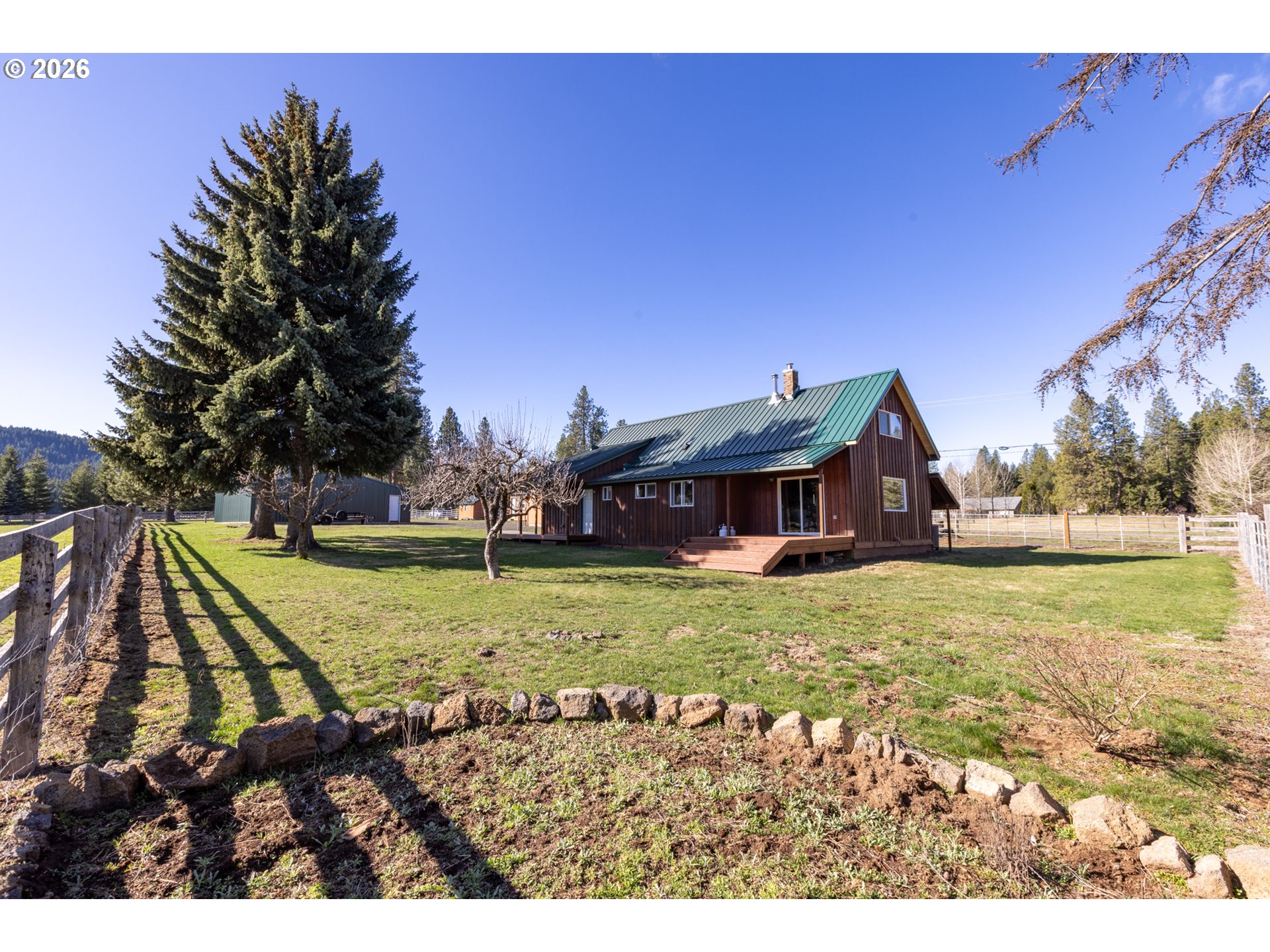 56 Jennings Road Trout Lake, WA 98650 - Photo 42 of 42 a view of a house with a yard