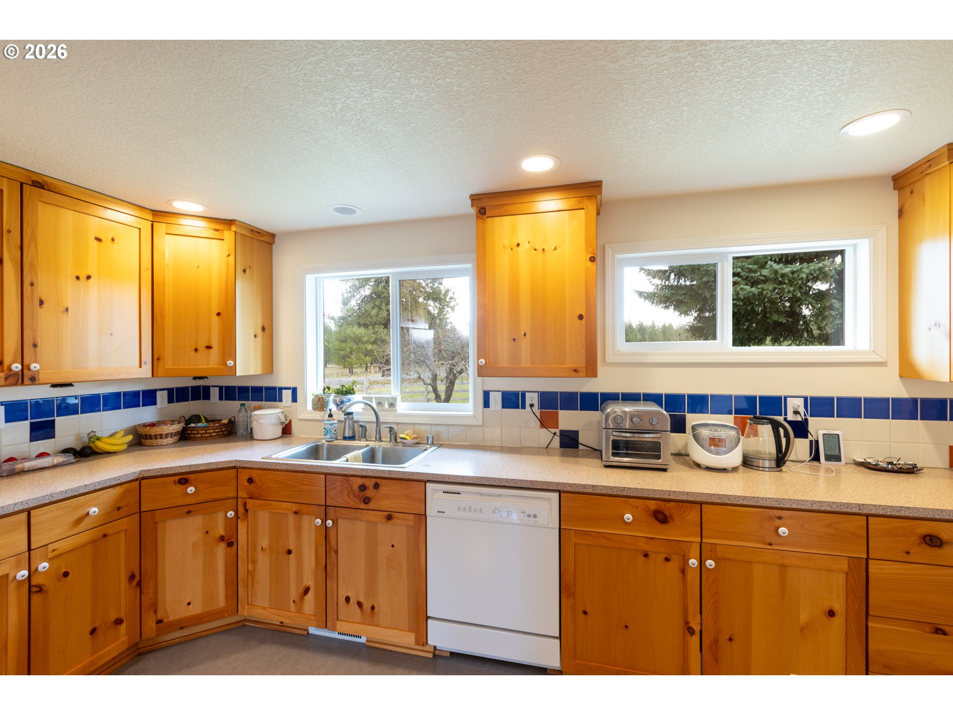 56 Jennings Road Trout Lake, WA 98650 - Photo 8 of 42 a kitchen with a sink a window and cabinets