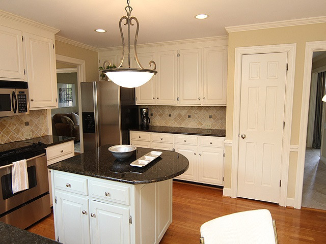 8013 Shellnut Road Raleigh, NC 27615 - Photo 9 of 25 Lots of storage space, pantry and island. Refrigerator conveys. Kitchen