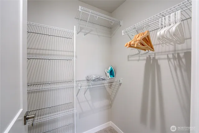 a view of hallway with wooden floor