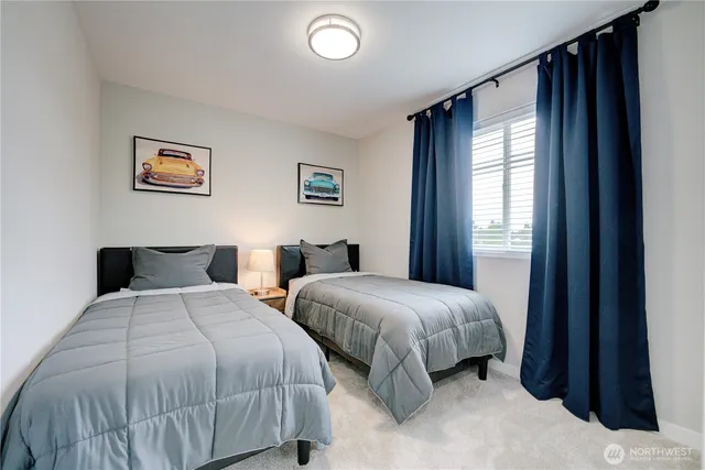 a view of a hallway with wooden floor and entryway