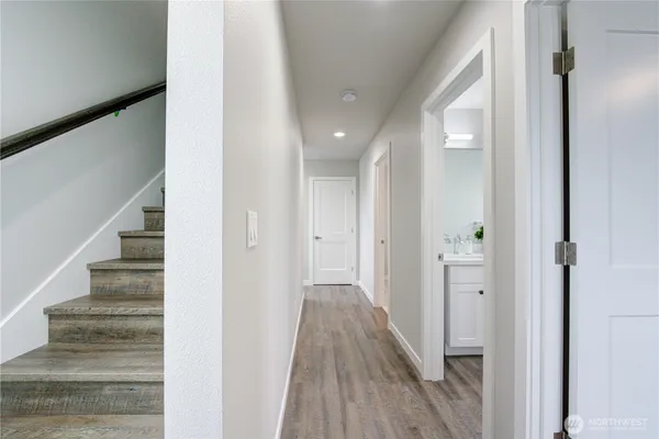 a large bed sitting in a bedroom next to a window