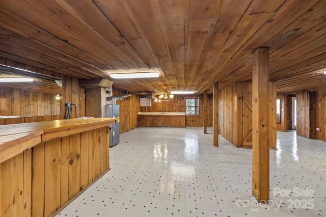 a view of a hallway with wooden shelves