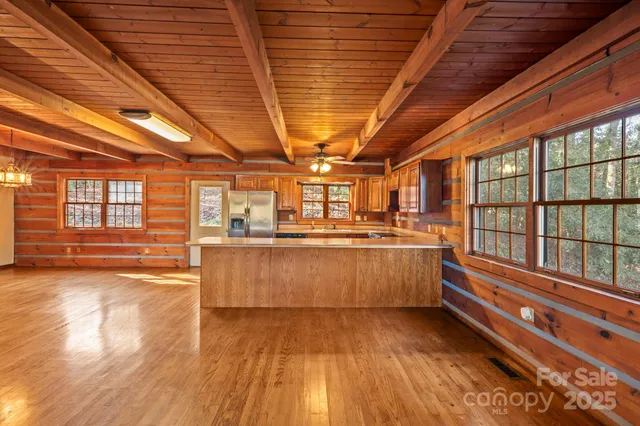 a view of a room with wooden floors