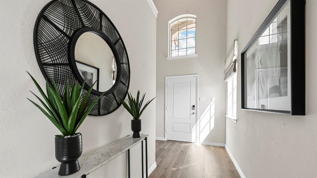 1305 Rusted Rail Drive Princeton, TX 75407 - Photo 17 of 35 a view of a house with a potted plant and a window