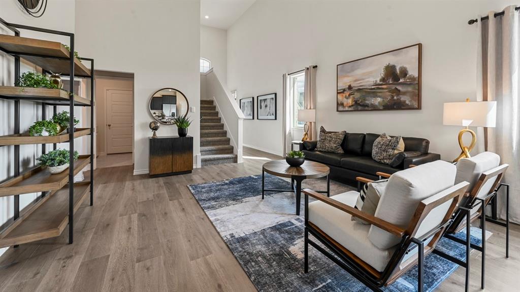1305 Rusted Rail Drive Princeton, TX 75407 - Photo 27 of 35 a living room with furniture a rug and a window
