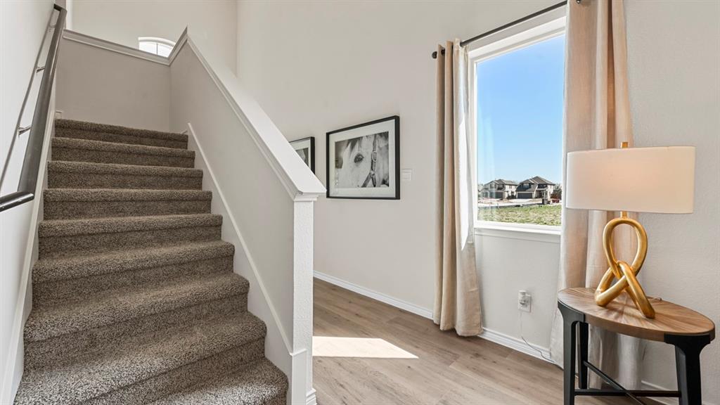 1305 Rusted Rail Drive Princeton, TX 75407 - Photo 32 of 35 a view of entryway and hall with wooden floor