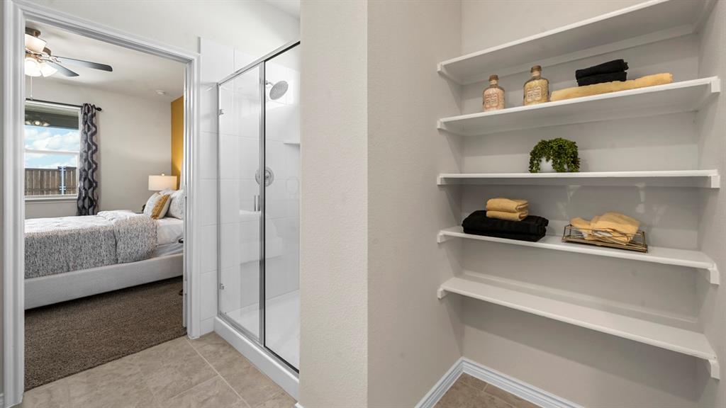 1305 Rusted Rail Drive Princeton, TX 75407 - Photo 6 of 35 a en suite bathroom with a toilet and a shower