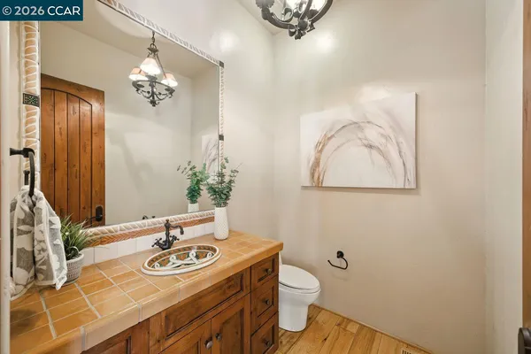 a bathroom with a sink mirror and vanity