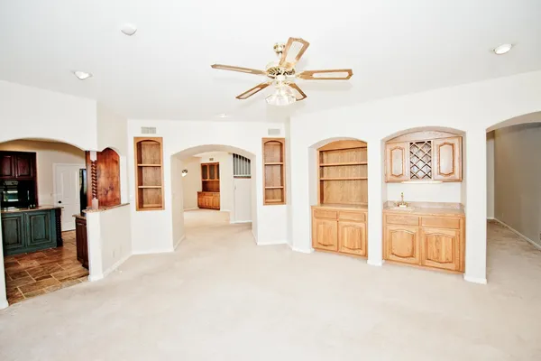 a view of walk in closet with empty racks