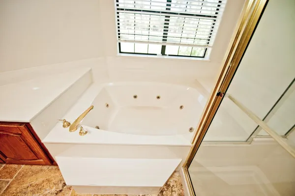a bathroom with a sink a mirror and a shower