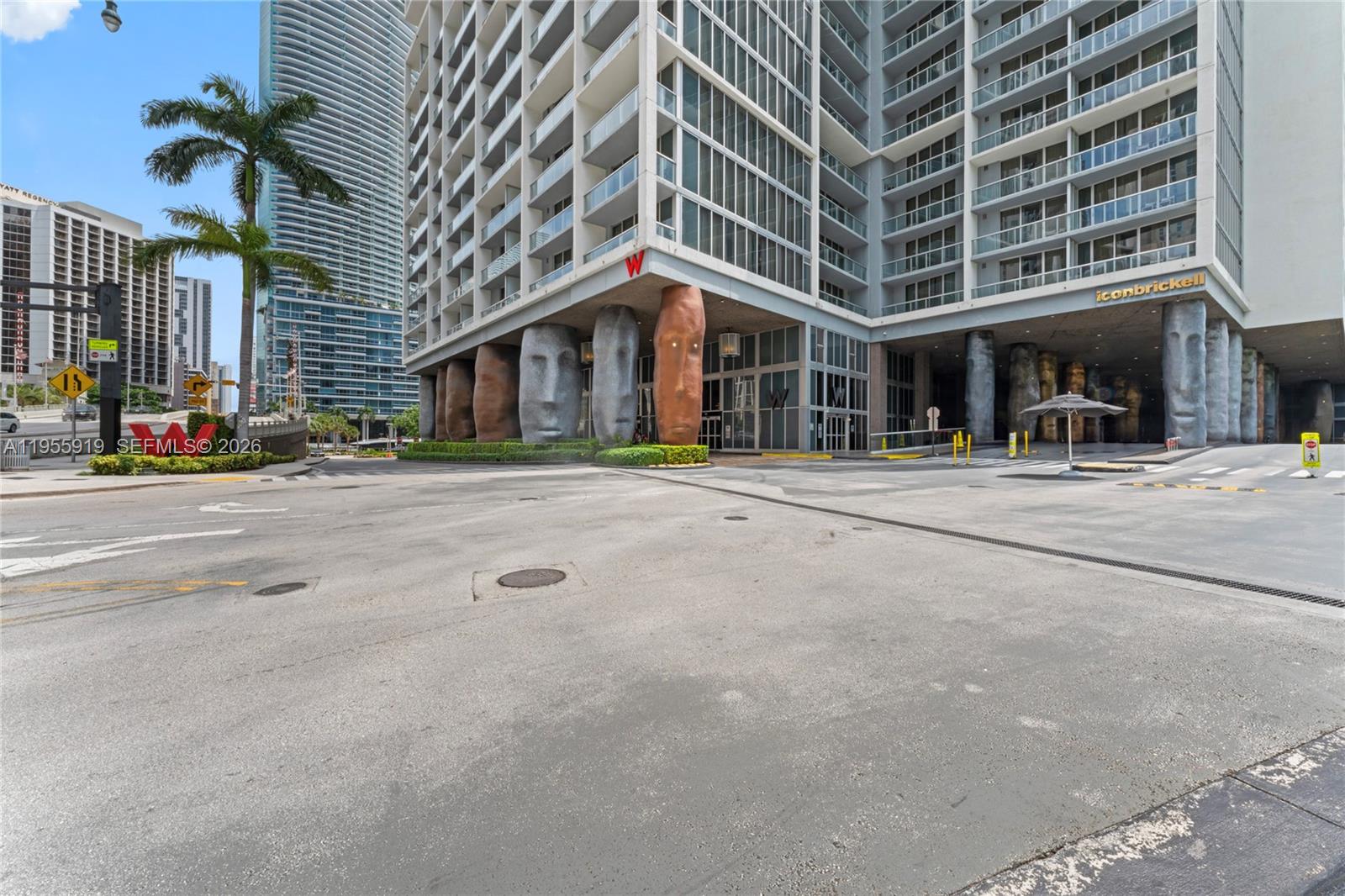 495 Brickell Avenue, Unit 3208 Miami, FL 33131 - Photo 45 of 51 a front view of a building with large trees