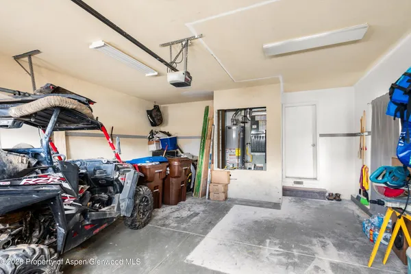 a view of a garage with a lot of stuff and toys