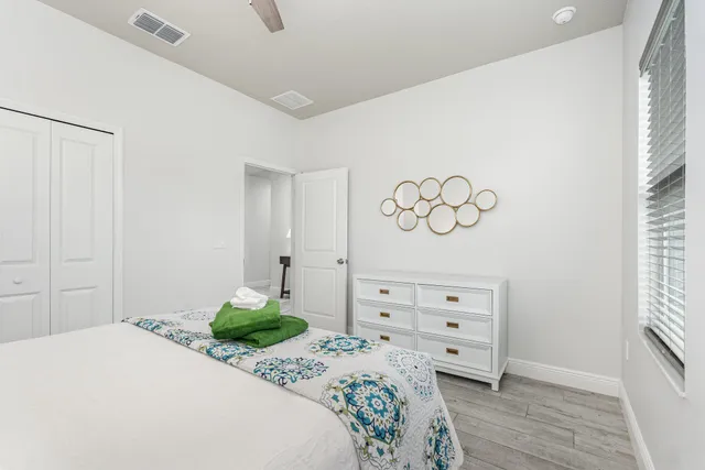 a bedroom with a bed and a dresser