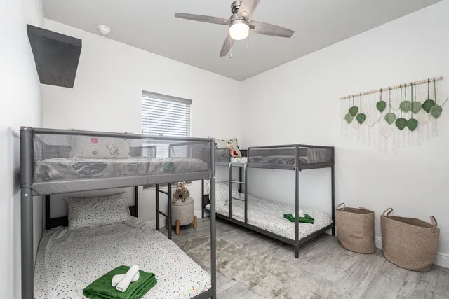 a bedroom with furniture and a chandelier