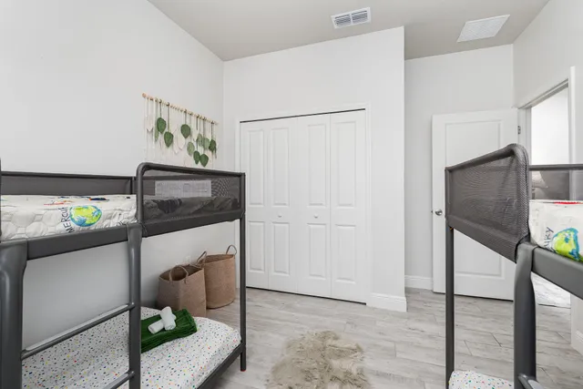 a hallway with a stove a microwave and a refrigerator