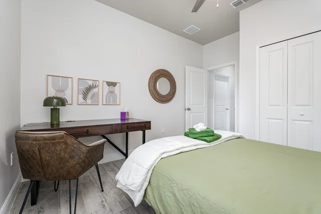 a bedroom with a bed and a closet