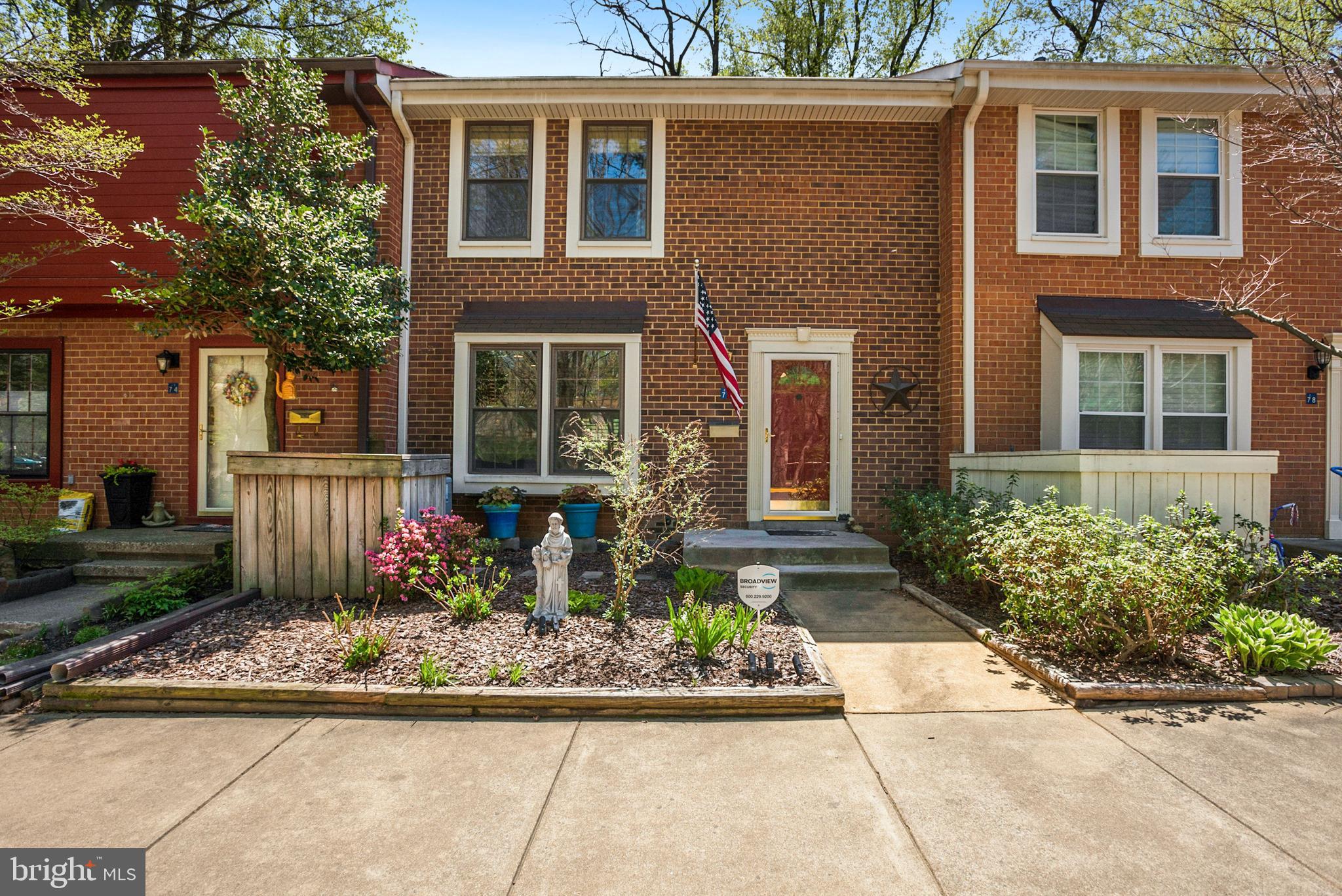 2076 Golf Course Drive Reston, VA 20191 - Photo 1 of 61 a front view of a house with garden
