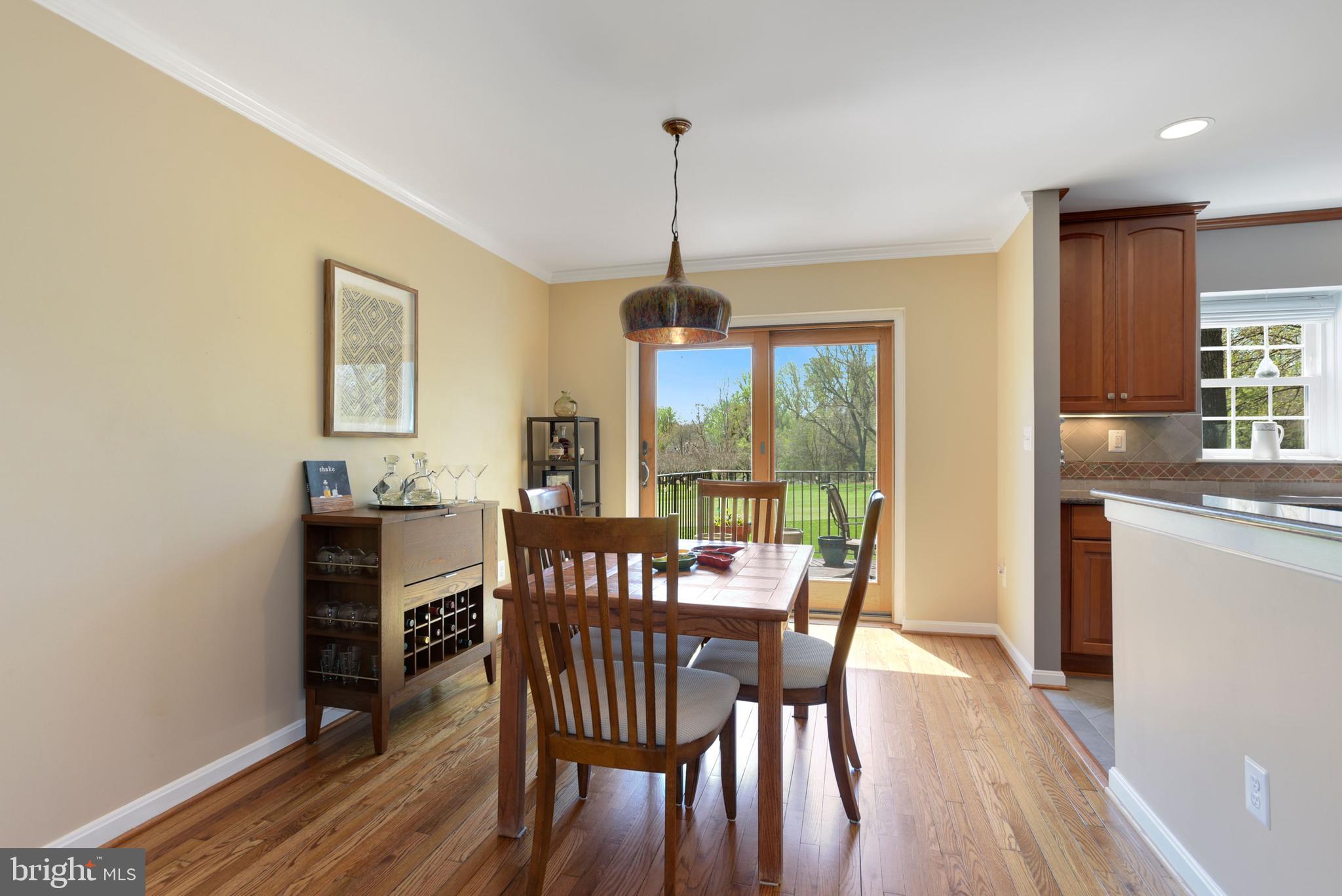 2076 Golf Course Drive Reston, VA 20191 - Photo 11 of 61 a dining room with furniture window wooden floor