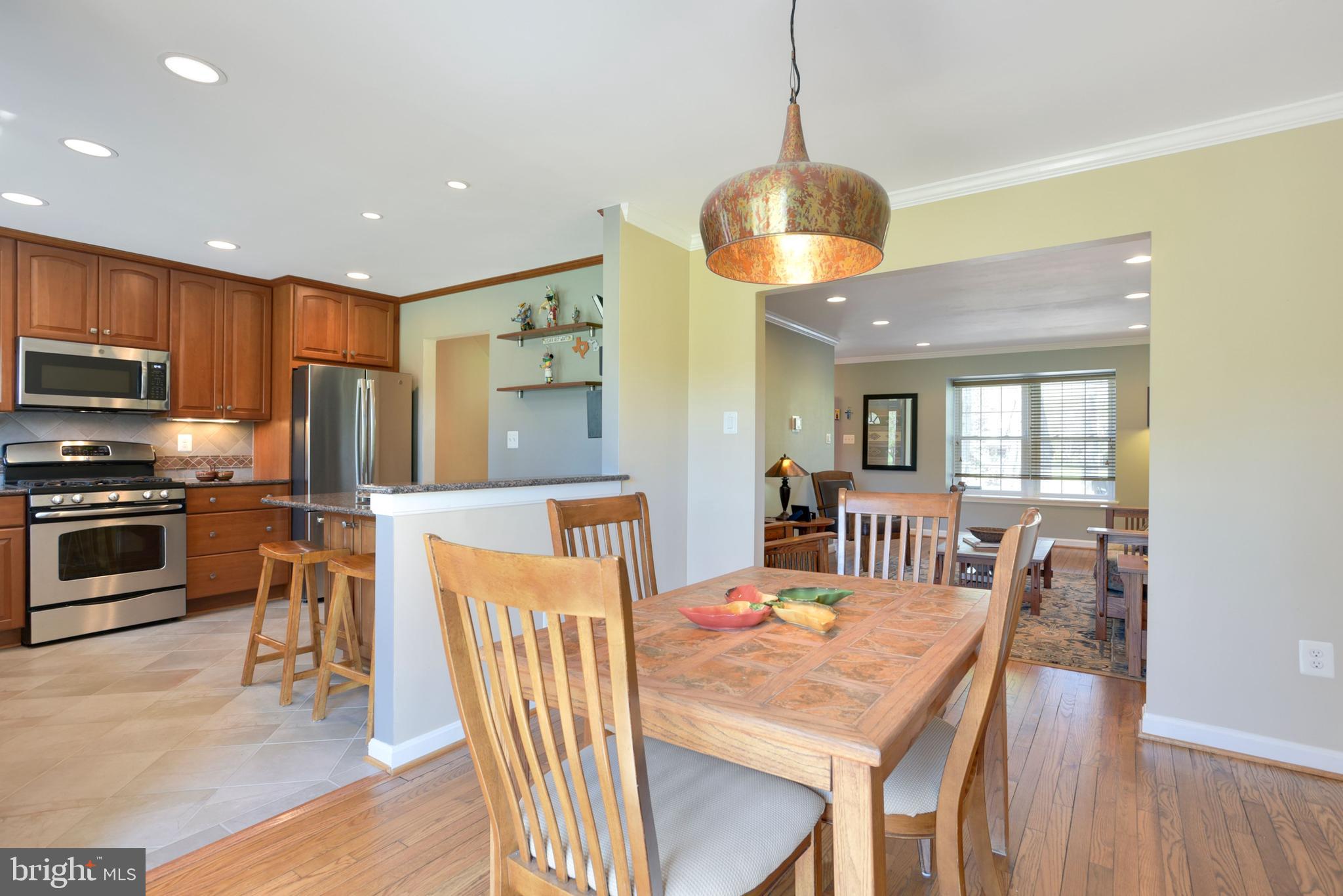 2076 Golf Course Drive Reston, VA 20191 - Photo 18 of 61 a view of a dining room with furniture window and wooden floor