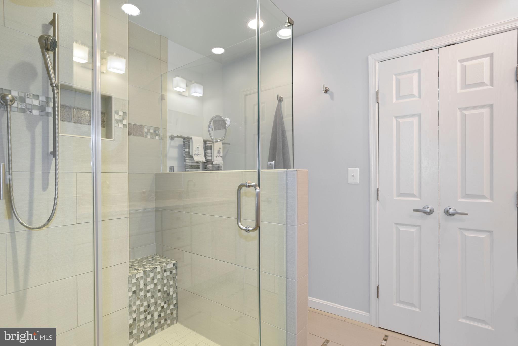 2076 Golf Course Drive Reston, VA 20191 - Photo 27 of 61 a bathroom with a glass shower door