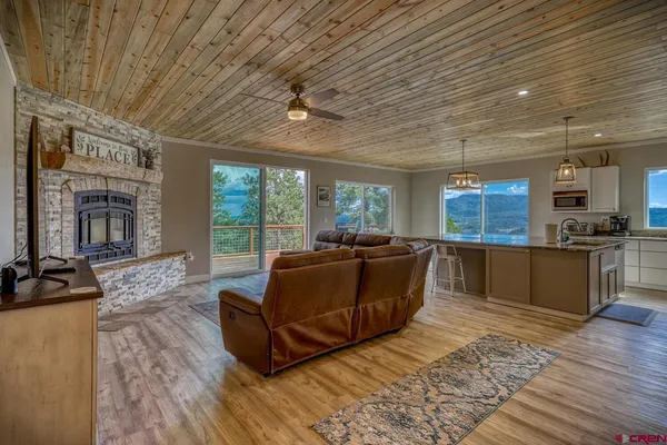 a living room with furniture window and wooden floor