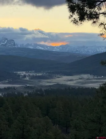 a view of mountains and valleys in the background