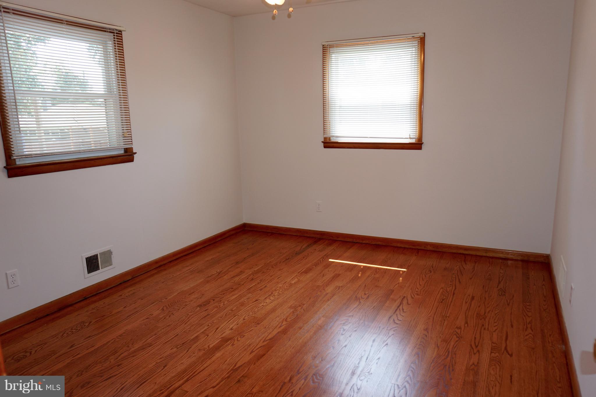 503 George Avenue Baltimore, MD 21221 - Photo 6 of 28 Main level bedroom refinished HW floors/new paint