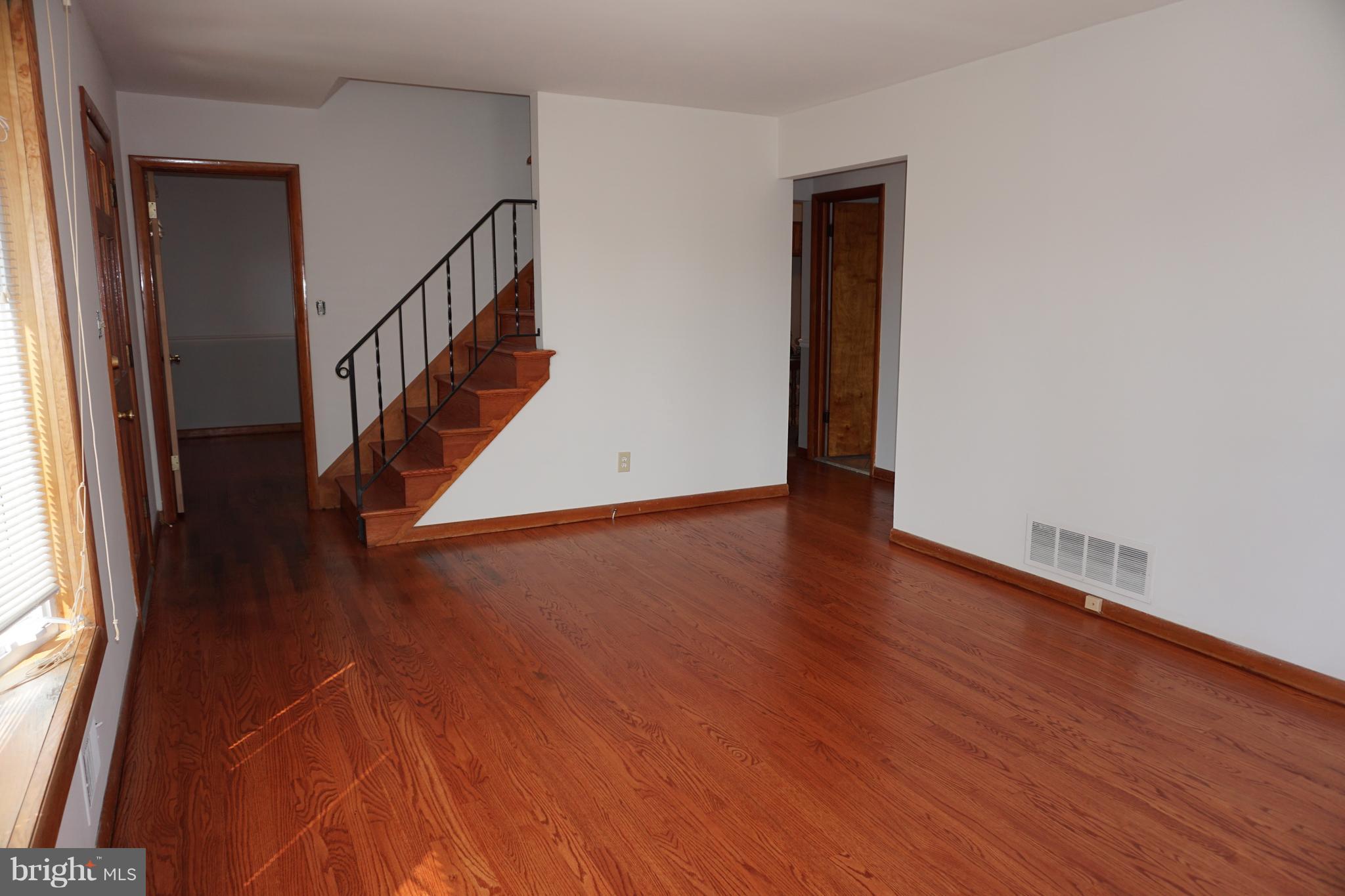 503 George Avenue Baltimore, MD 21221 - Photo 7 of 28 Refinished hardwood floors and New paint