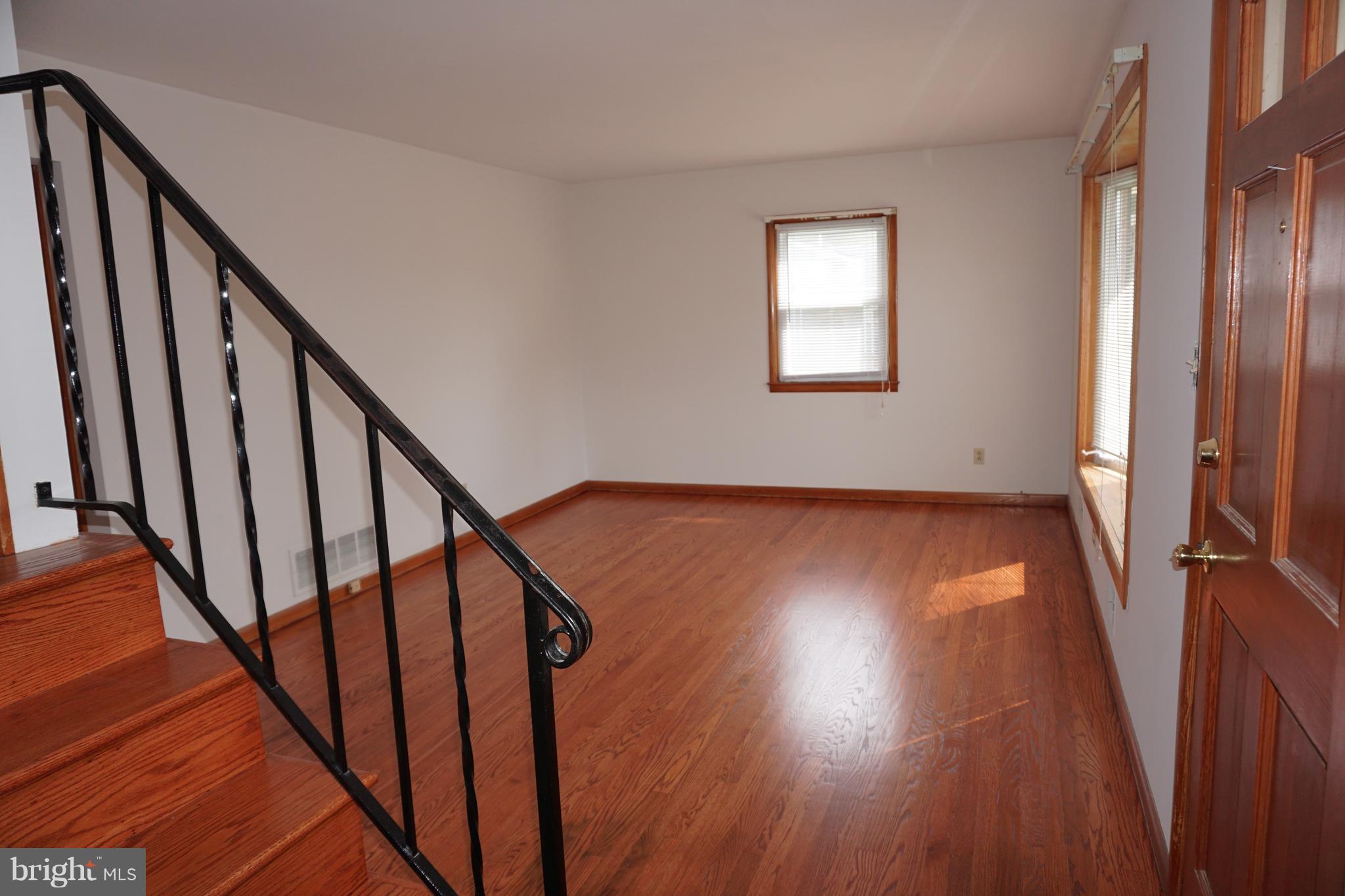 503 George Avenue Baltimore, MD 21221 - Photo 8 of 28 new paint and refinished hardwood flooring