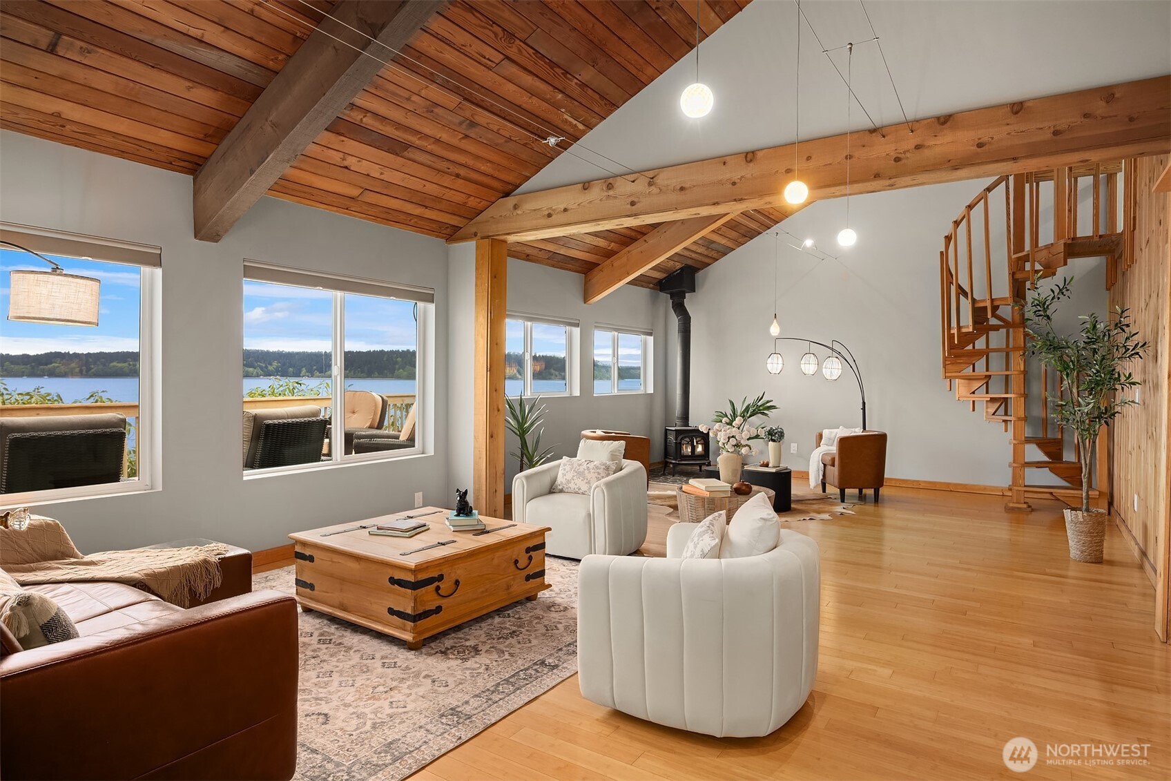 13725 Southwest Pohl Road Vashon, WA 98070 - Photo 13 of 40 a living room with furniture and a fireplace