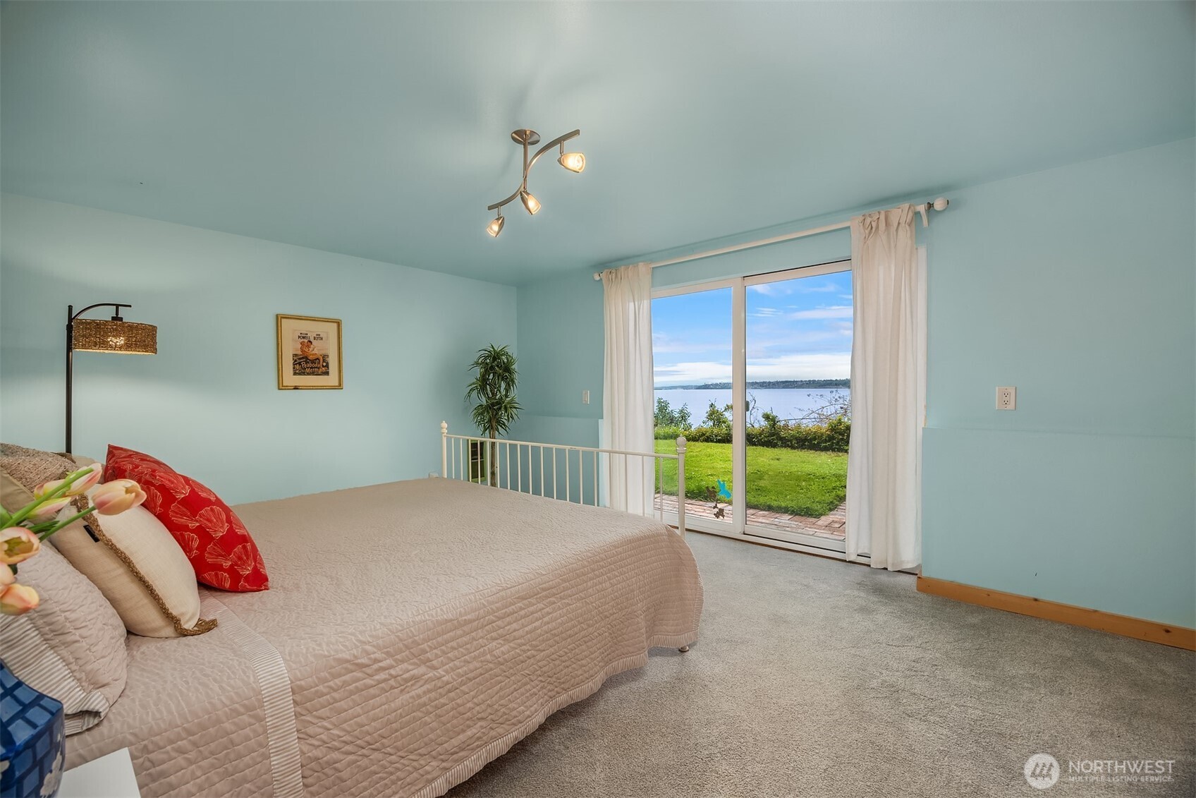 13725 Southwest Pohl Road Vashon, WA 98070 - Photo 19 of 40 a bed sitting in a bedroom next to a window