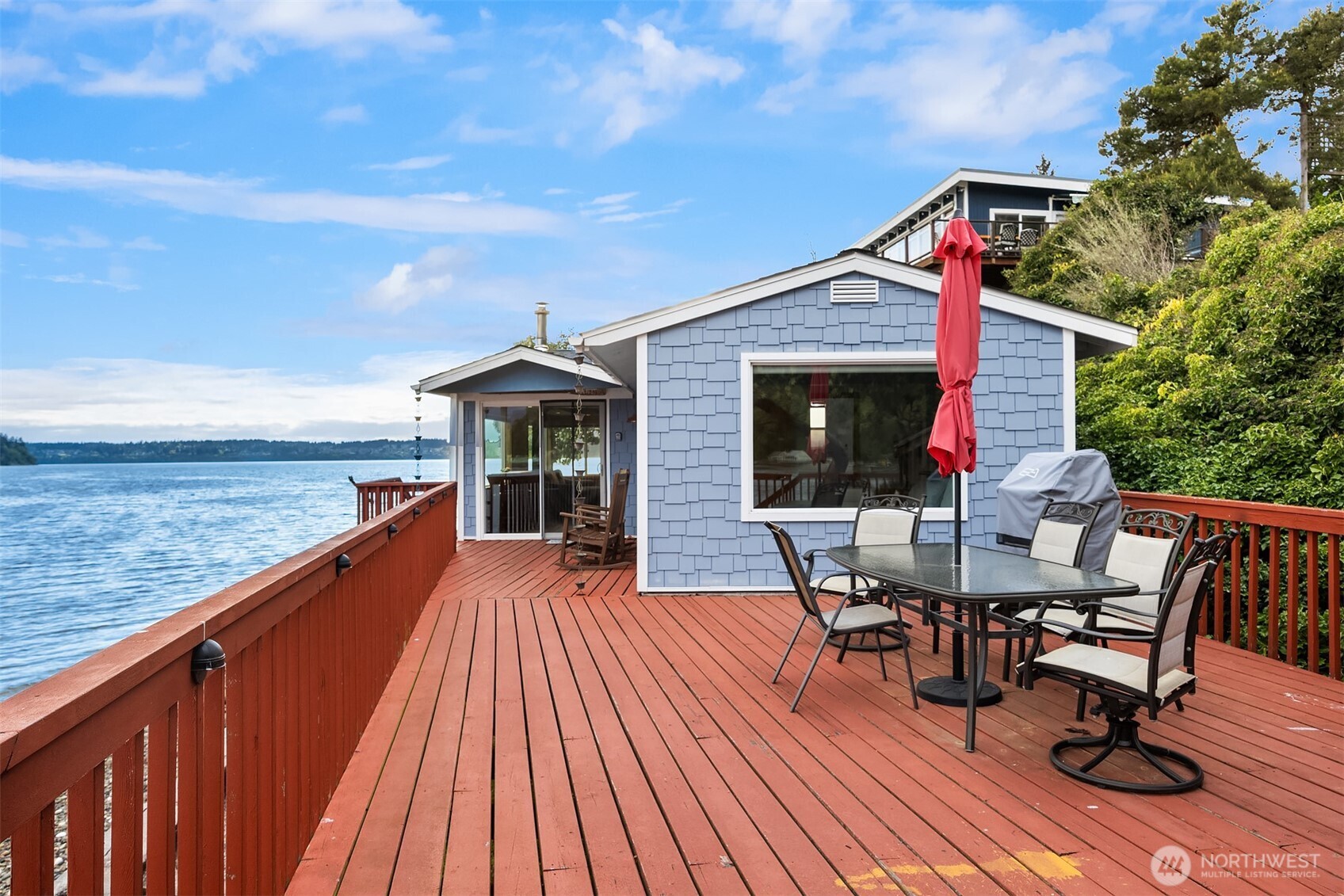 13725 Southwest Pohl Road Vashon, WA 98070 - Photo 24 of 40 a view of house with deck and outdoor seating