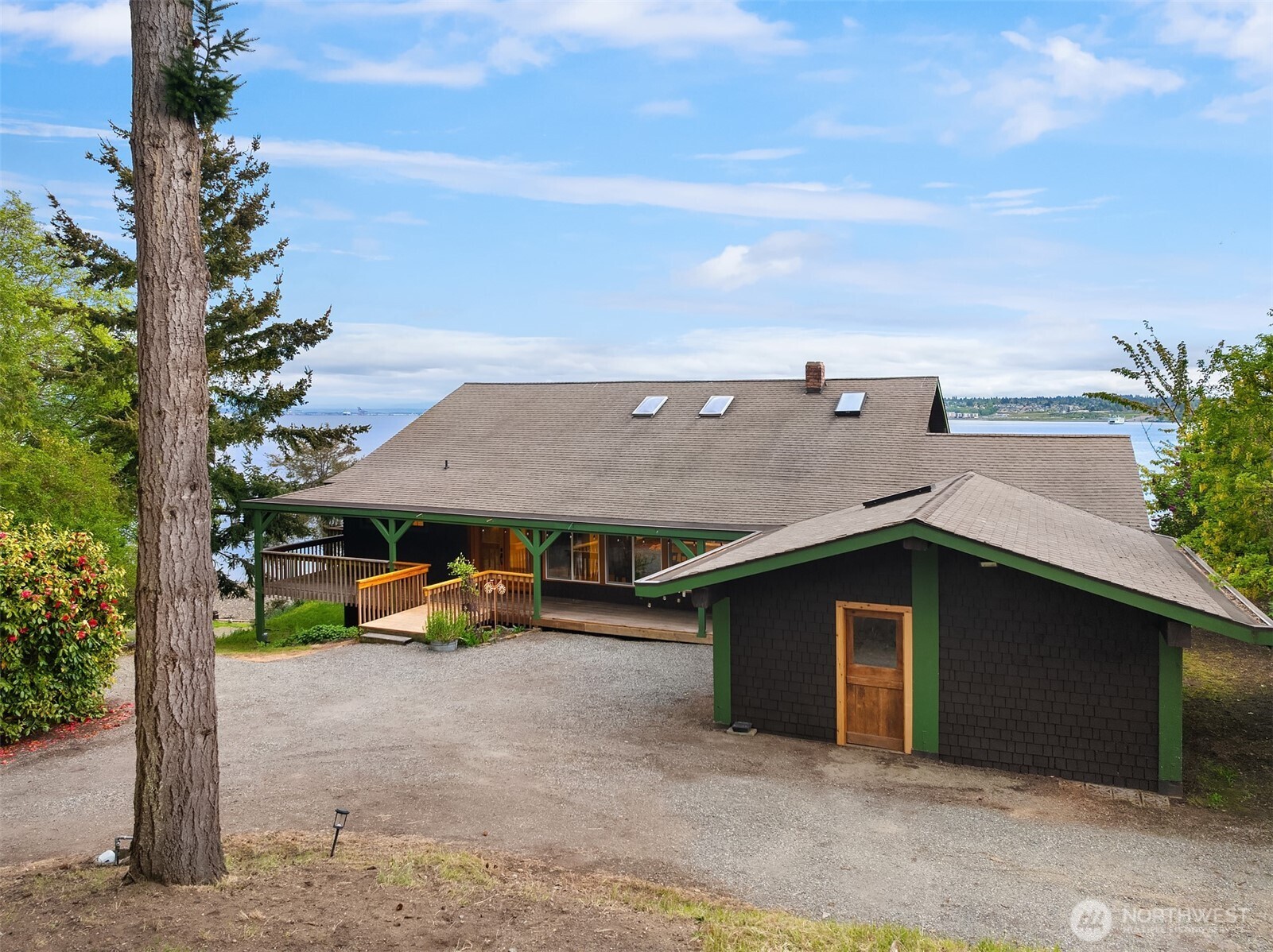 13725 Southwest Pohl Road Vashon, WA 98070 - Photo 4 of 40 an aerial view of a house with a yard and garage