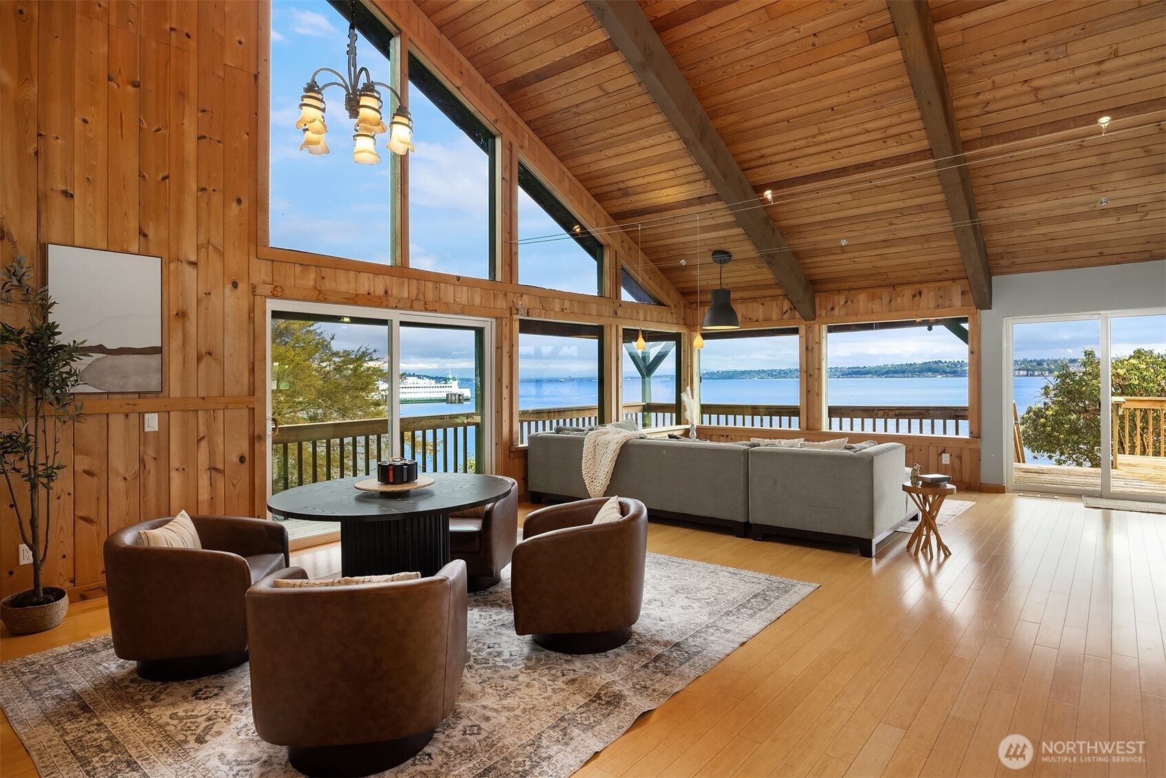 13725 Southwest Pohl Road Vashon, WA 98070 - Photo 6 of 40 a living room with furniture floor to ceiling window and wooden floor