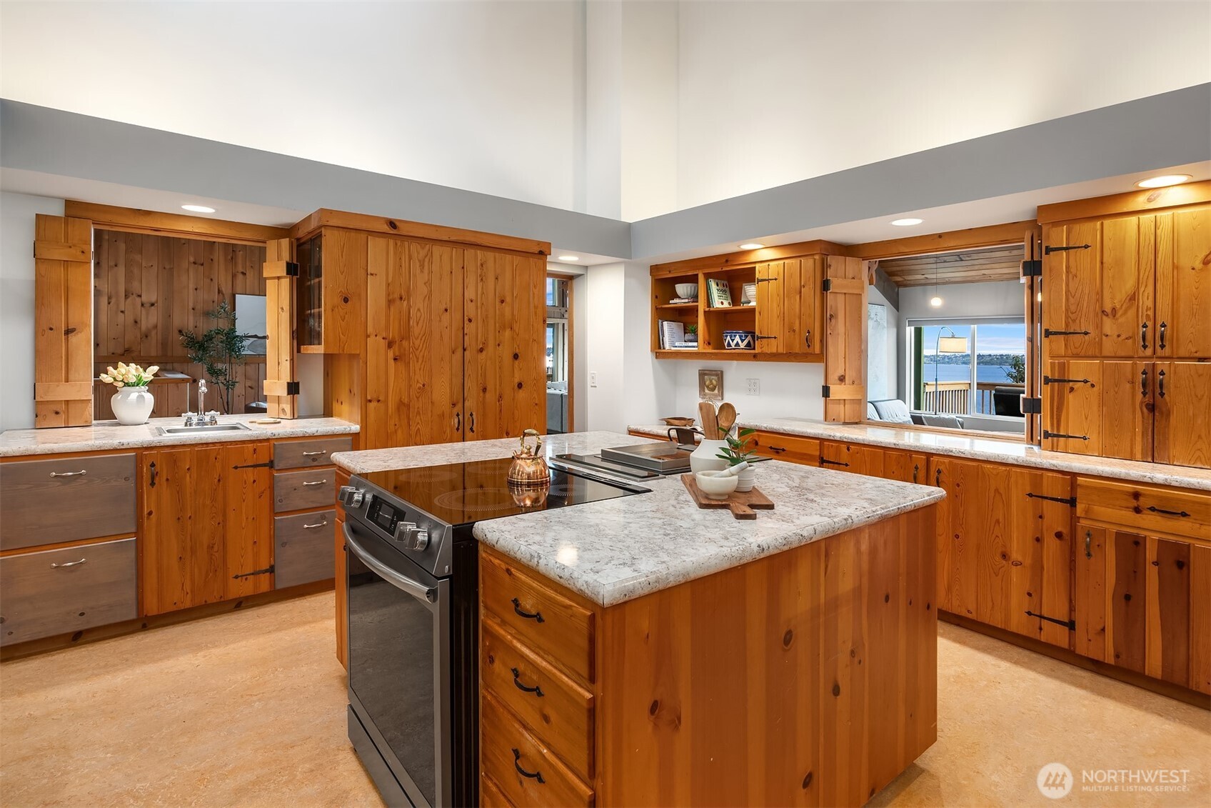 13725 Southwest Pohl Road Vashon, WA 98070 - Photo 10 of 40 a kitchen with a stove a sink and a refrigerator