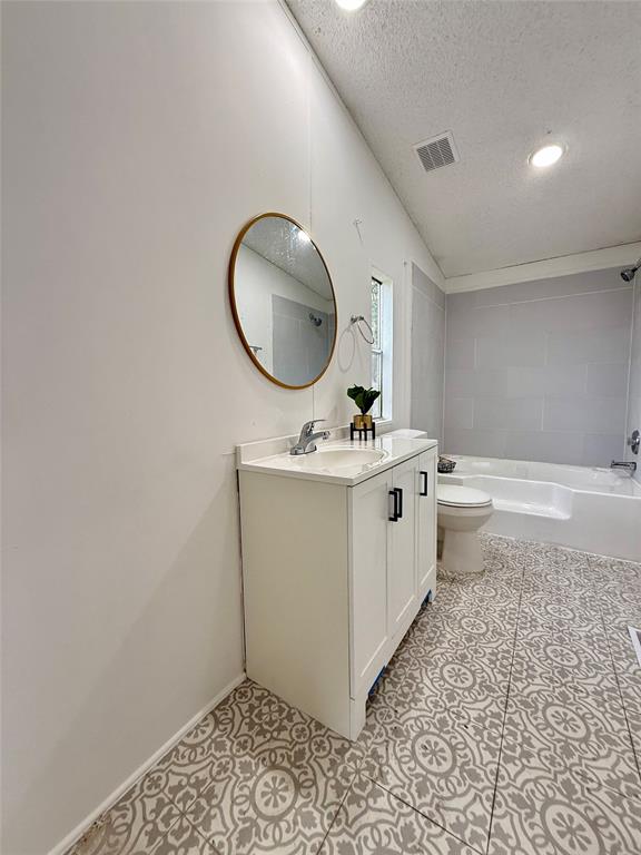 9123 Rodeo Drive Terrell, TX 75160 - Photo 9 of 16 a bathroom with a sink mirror vanity and toilet