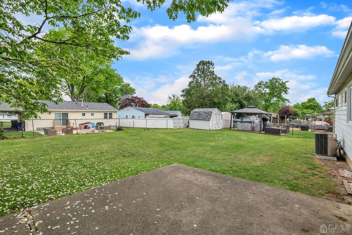 129 Princeton Road Old Bridge, NJ 08859 - Photo 18 of 26 a view of a house with a backyard